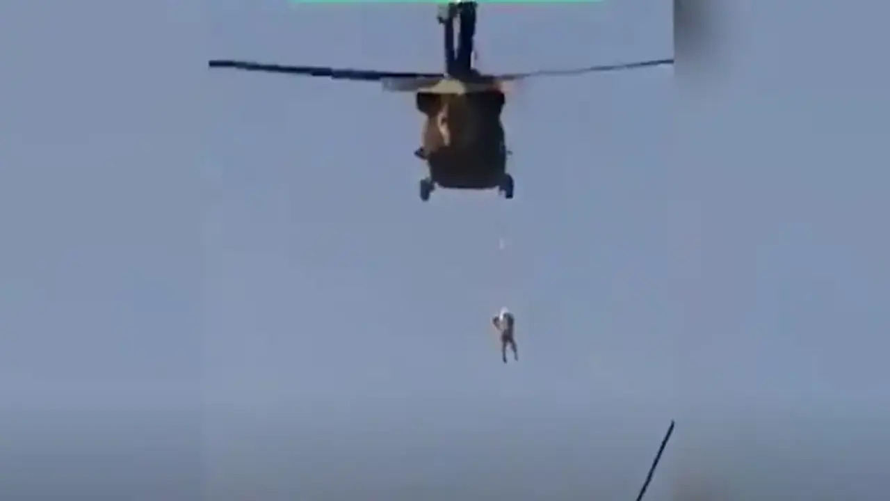 Video appears to show Taliban member hanging from US-supplied helicopter ‘over Kandahar’